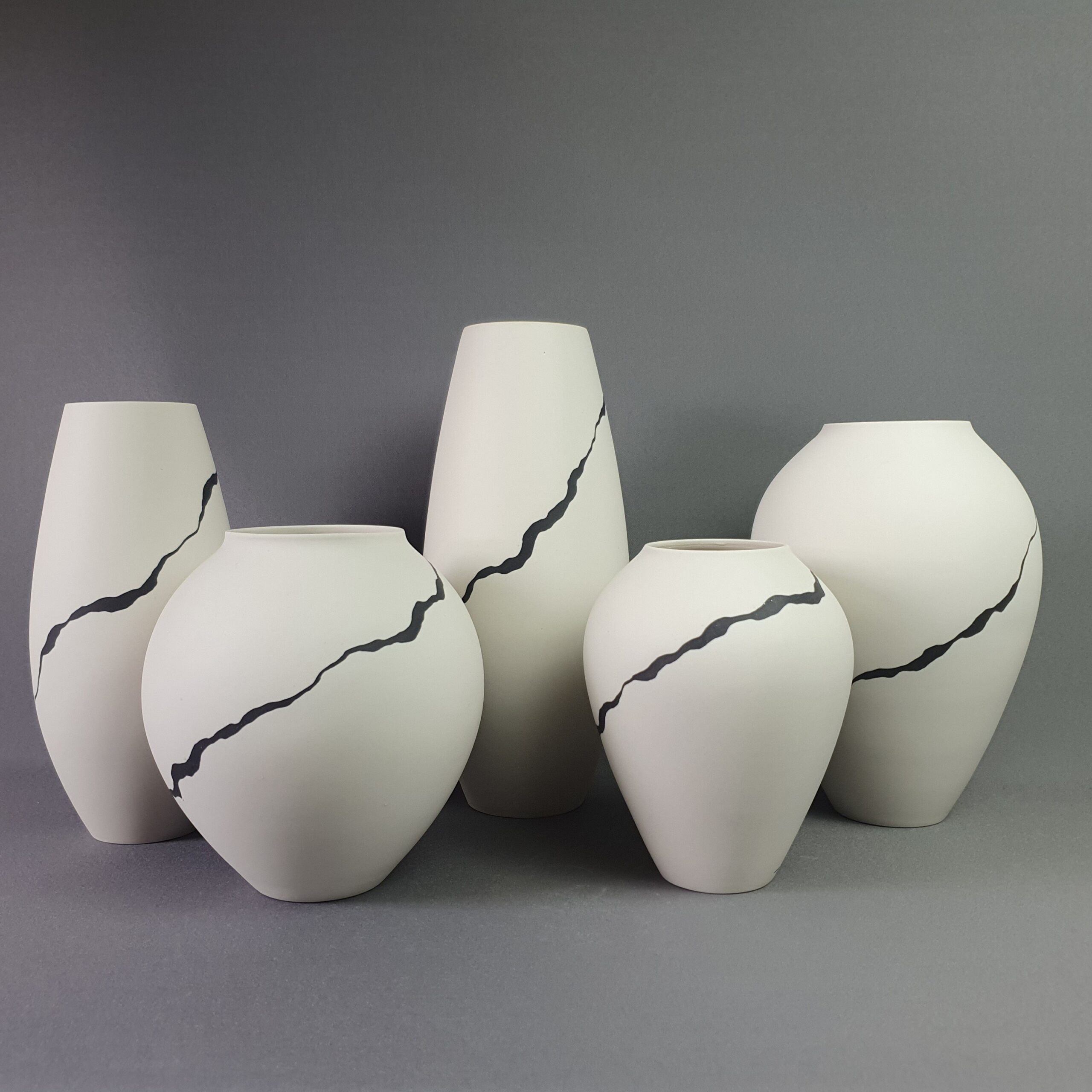 Leonie Rutter. Porcelain vessels with black inlay ribbon